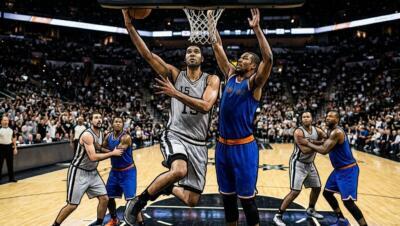 NBA Finals Game 1 action with players battling near the basket in a packed arena.